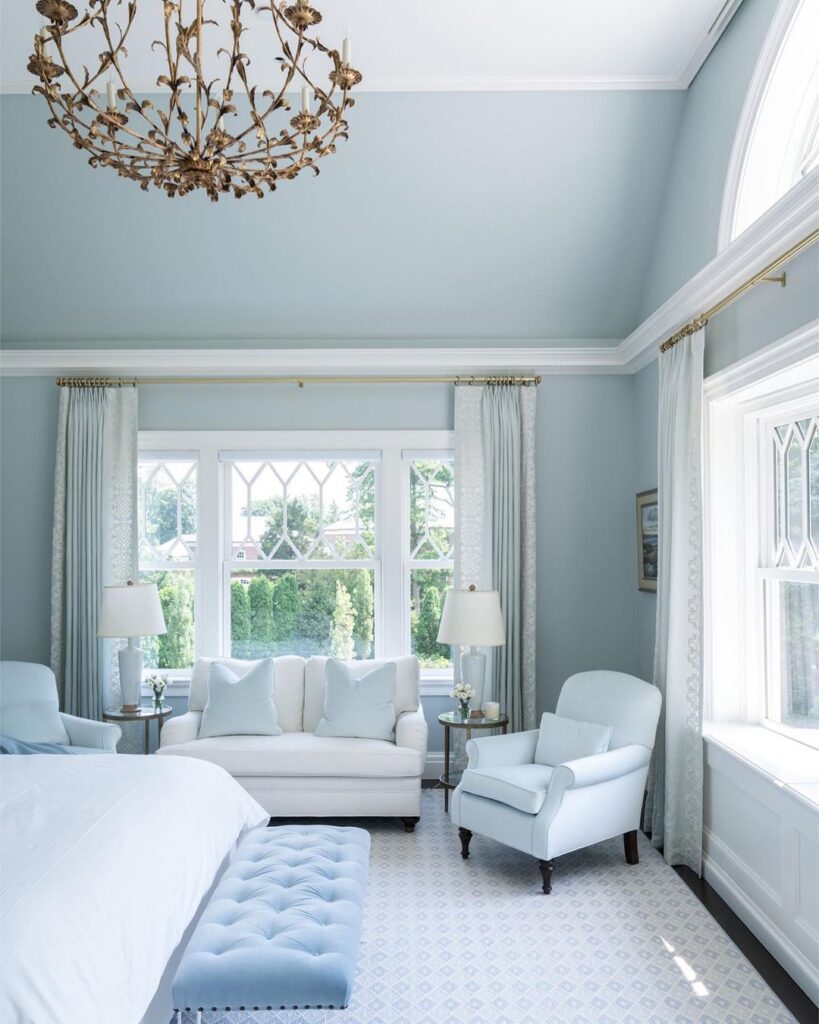 Blue bedroom, white furniture, floral chandelier