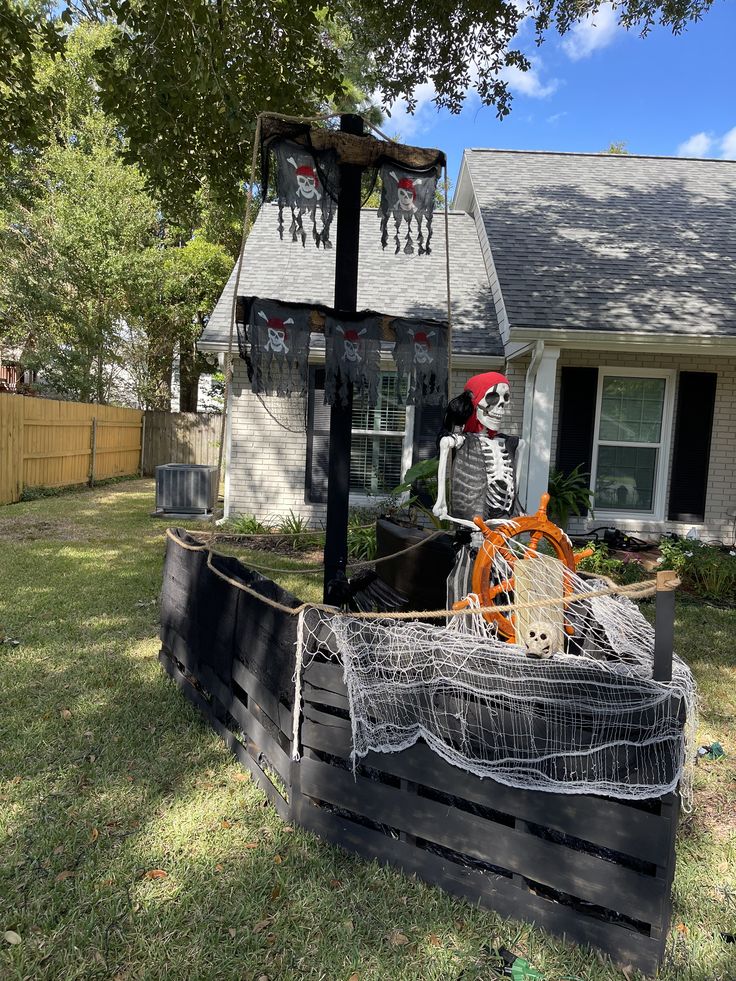 Skeleton pirate on makeshift ship in suburban yard