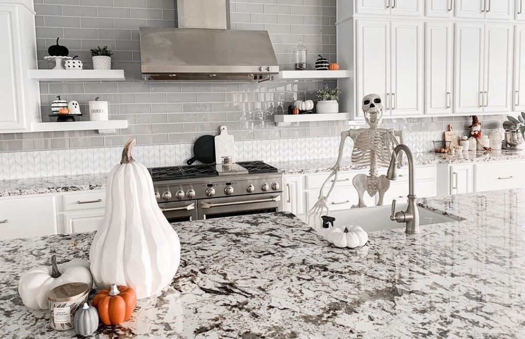 Skeleton decoration in stylish Halloween-themed kitchen