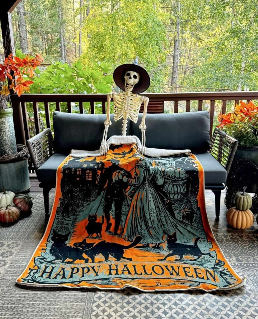 Skeleton on porch, Halloween blanket, autumn decor