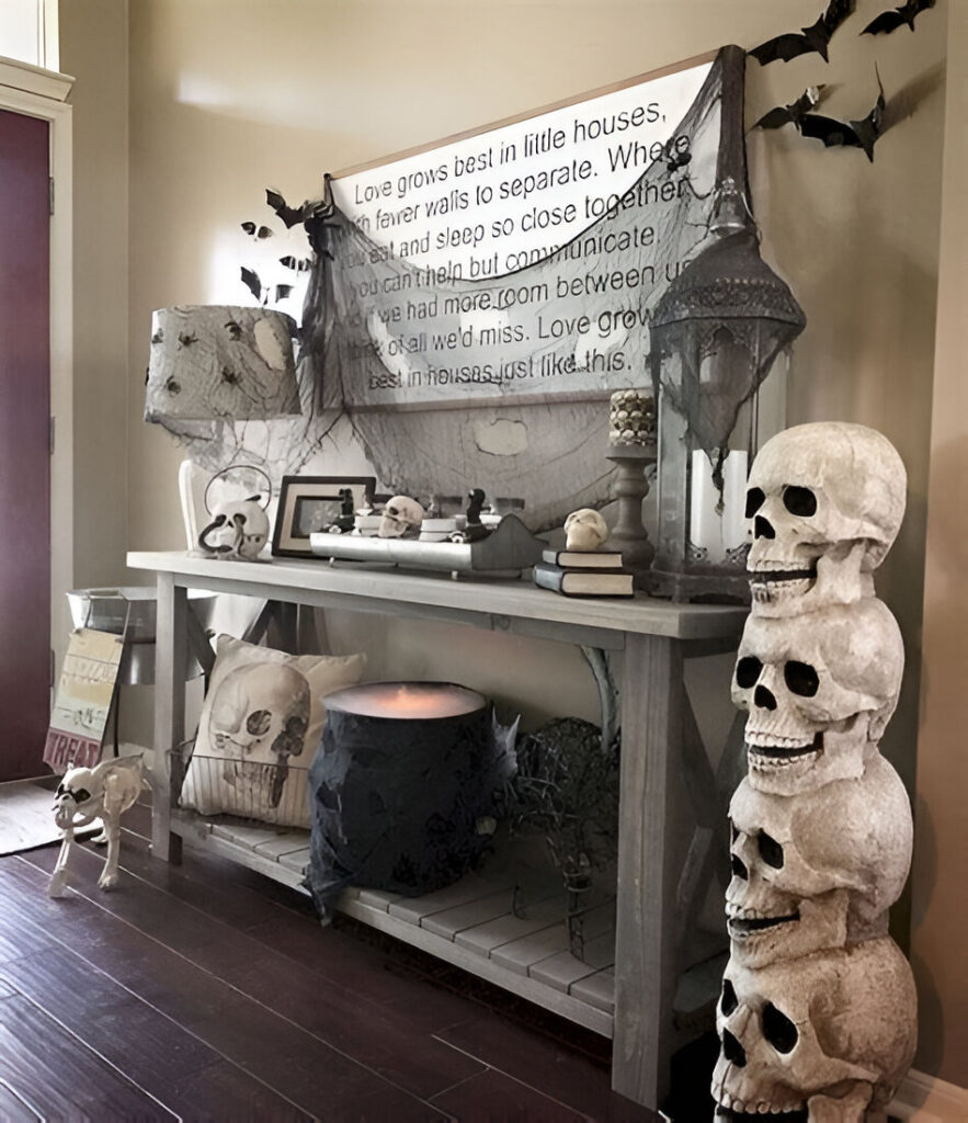 Halloween console table with skulls and quote