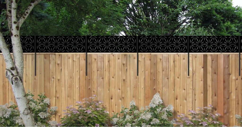 Wooden fence with decorative lattice top and flowers