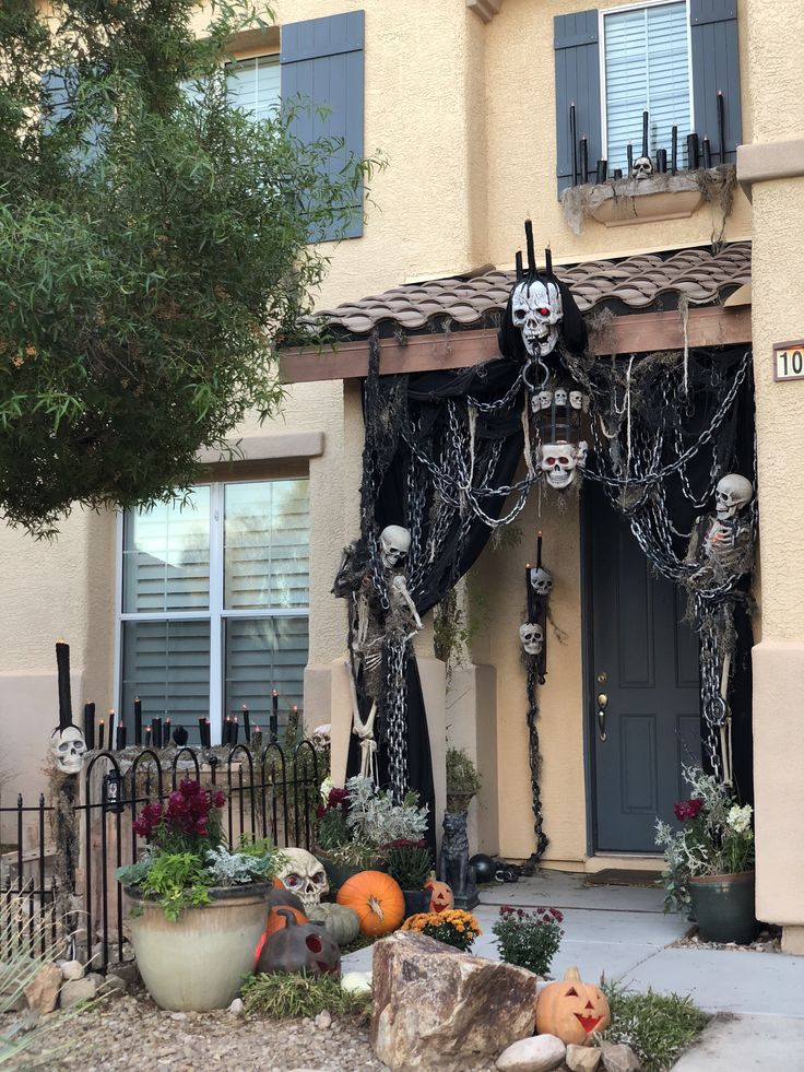 House entrance decorated with skeletons and Halloween props