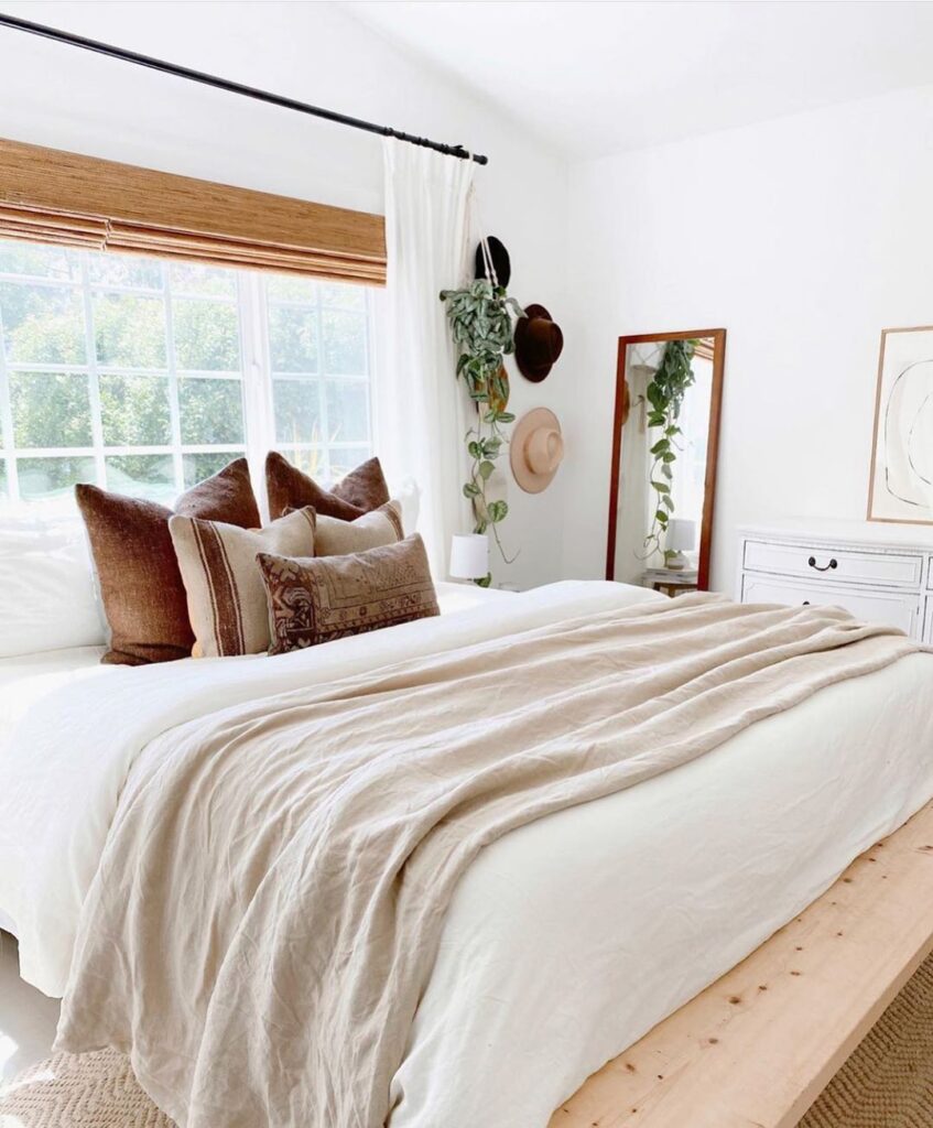 Bright bedroom, large window, boho decor