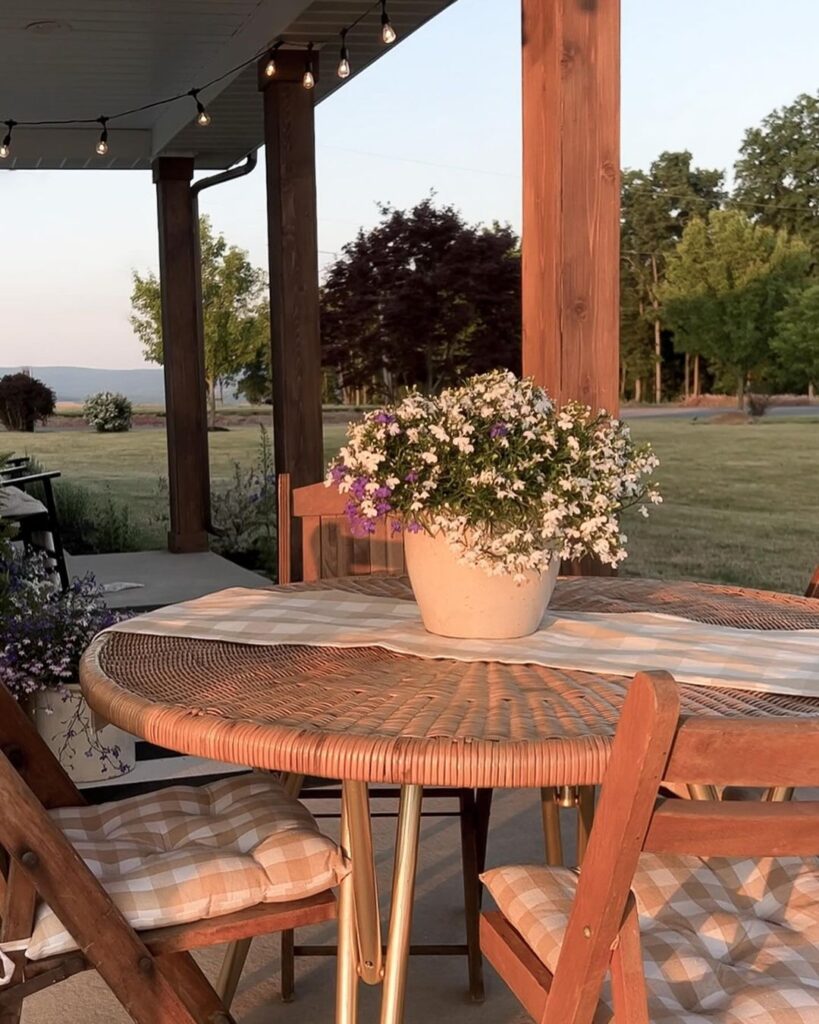 Porch table flowers countryside view sunset