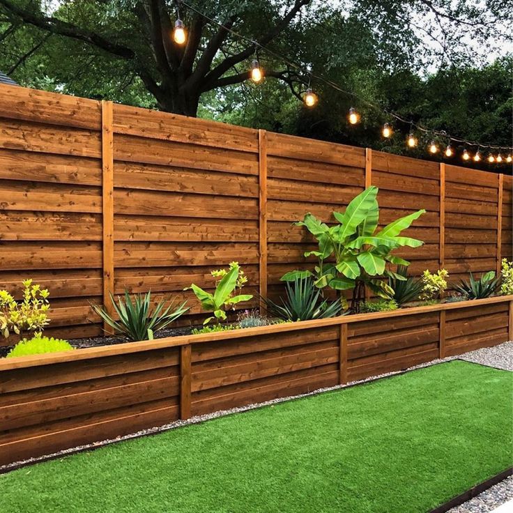 Wooden fence with built-in tropical planter