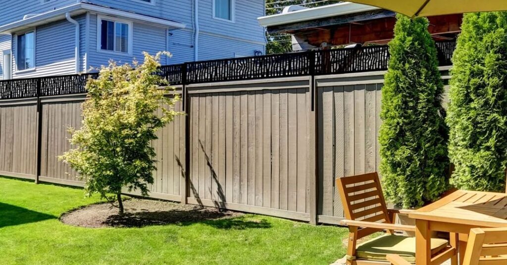 Taupe fence with black lattice top