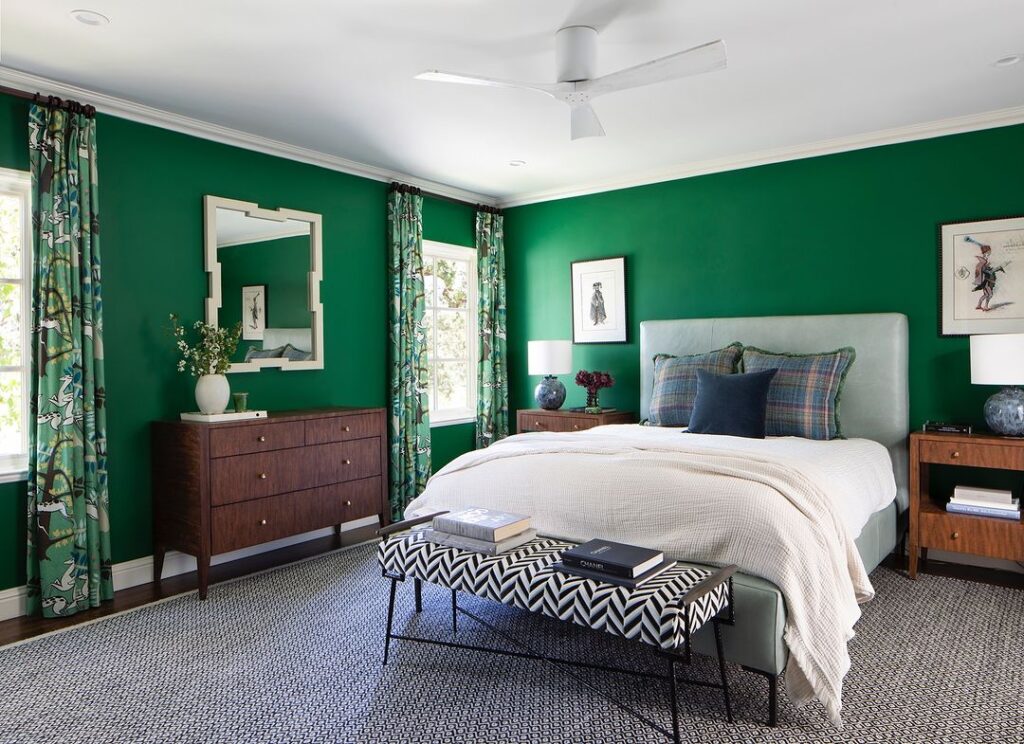 Emerald green walls, floral curtains, eclectic decor