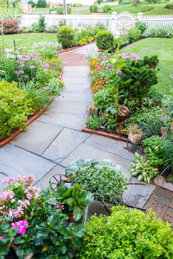 Flower-lined path, colorful garden, diverse plants