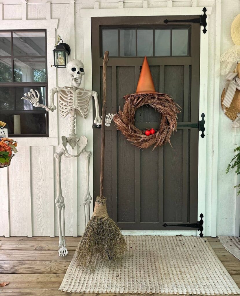 Skeleton, witch wreath, rustic Halloween porch