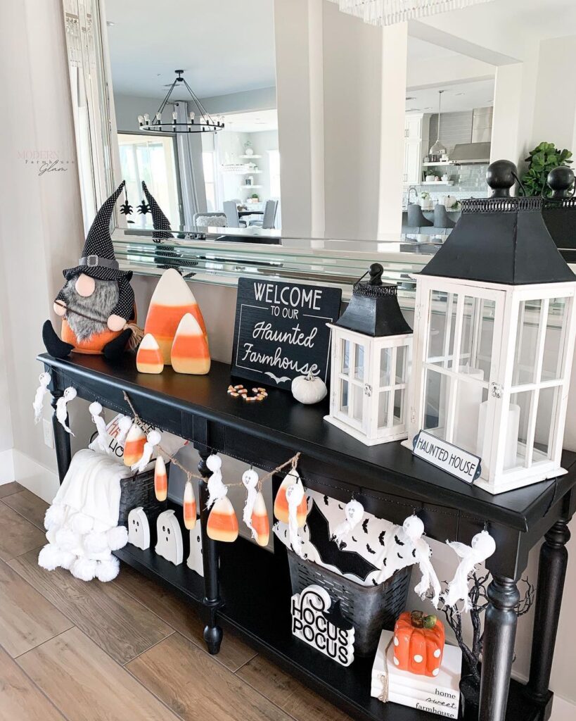 Halloween decorated console table with gnome and candy corn decor