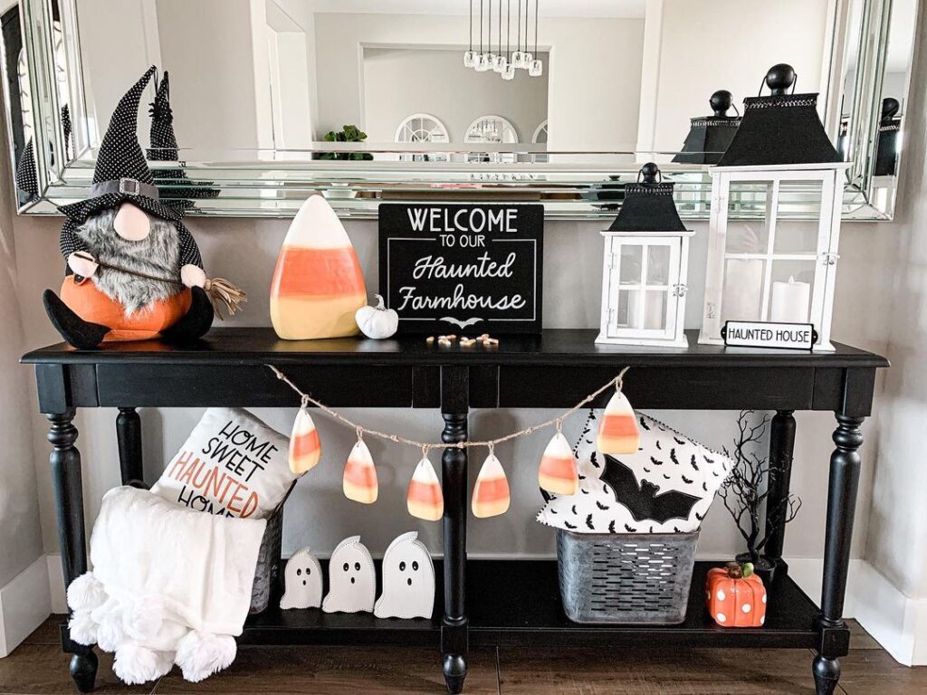 Halloween farmhouse entryway table with festive decorations