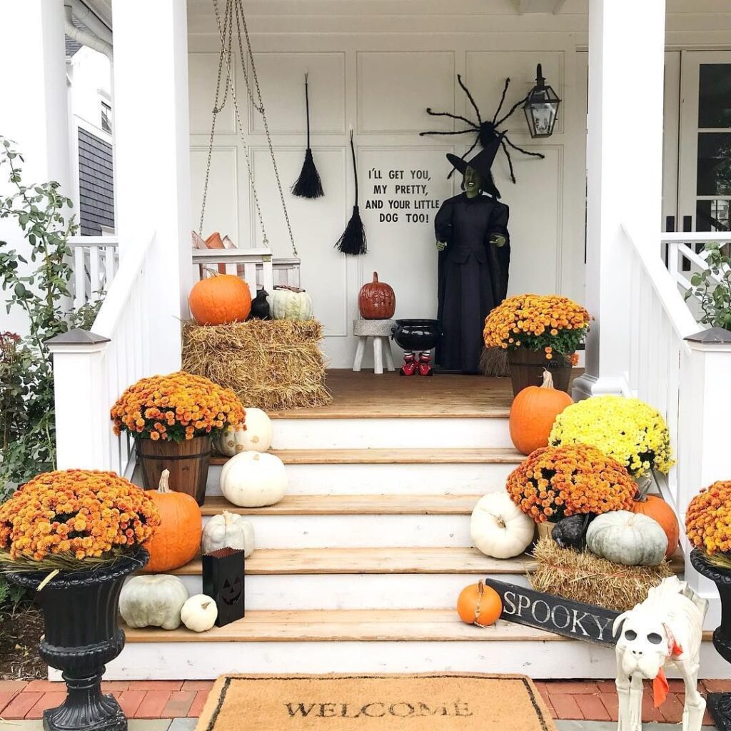 Halloween porch witch mums pumpkins decorations