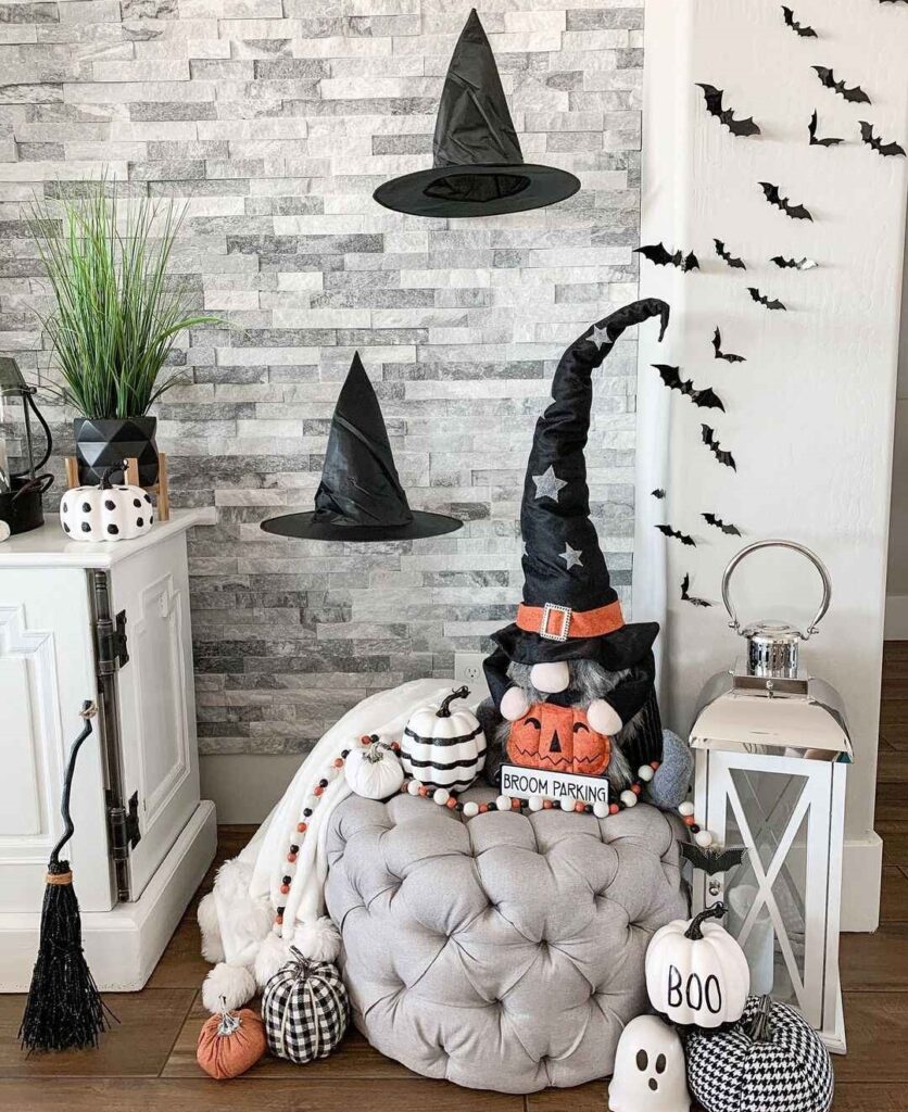 Witch gnome with pumpkins on tufted ottoman