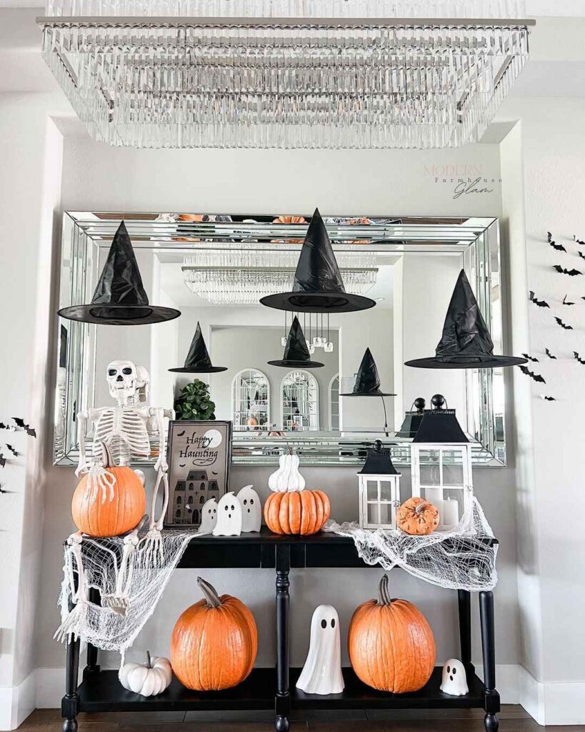 Halloween entryway with floating witch hats and pumpkins