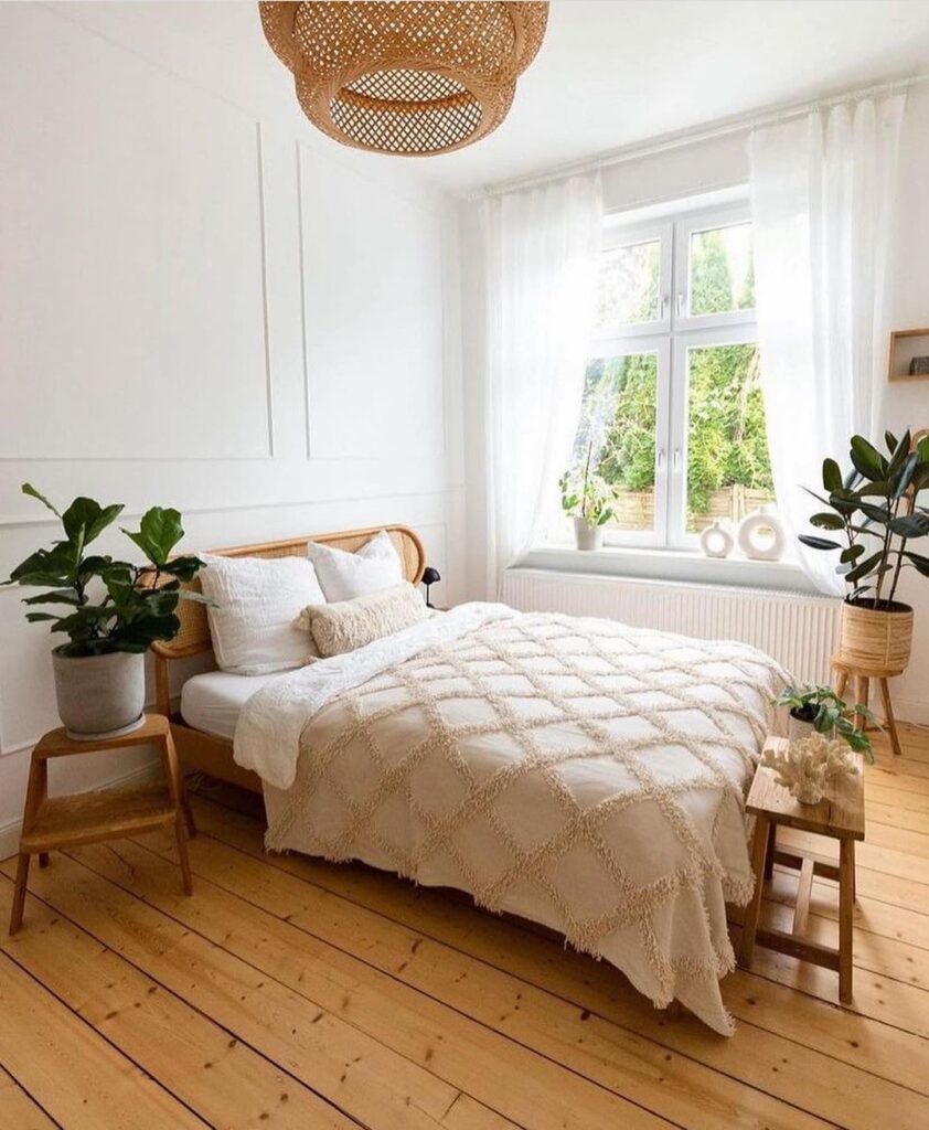 Bright bedroom with wooden furniture and plants