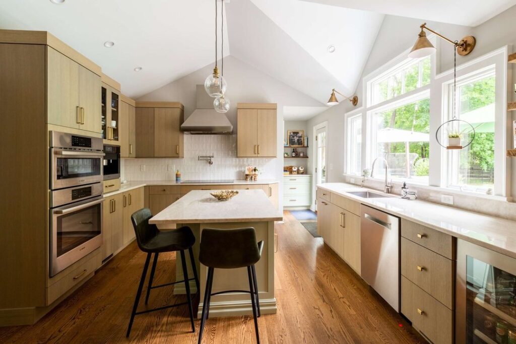 Bright kitchen with wood cabinets and vaulted ceiling