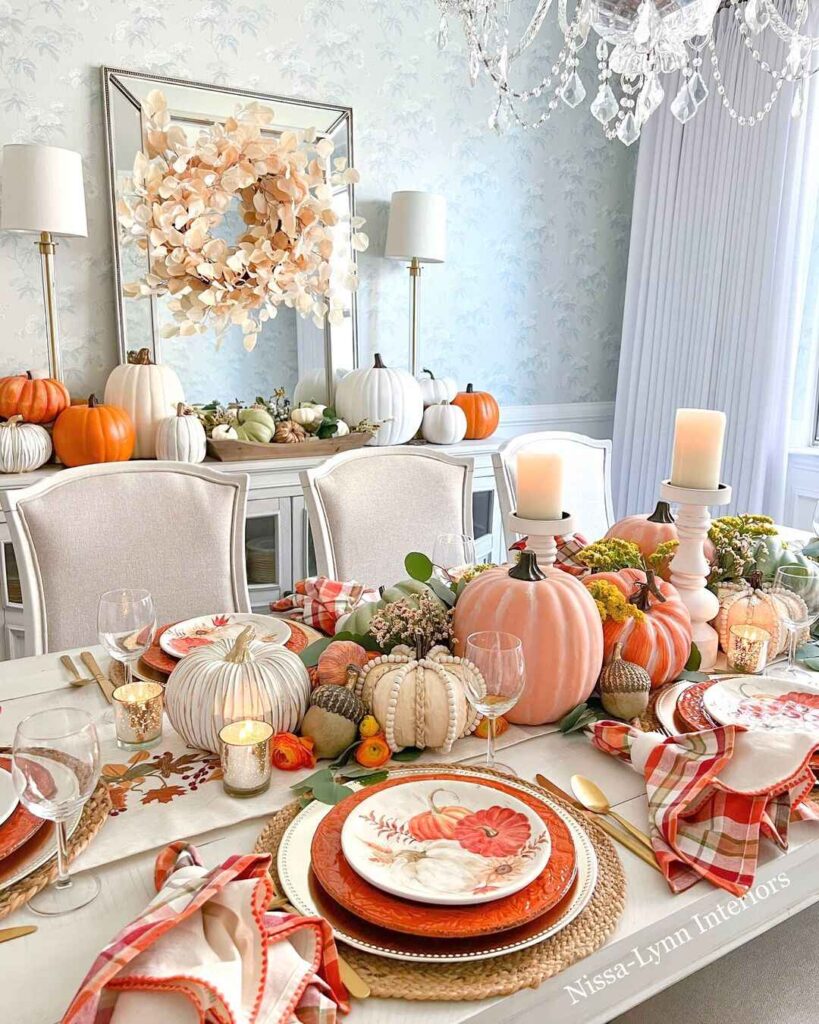 Elegant Thanksgiving table with pastel pumpkins and crystal chandelier