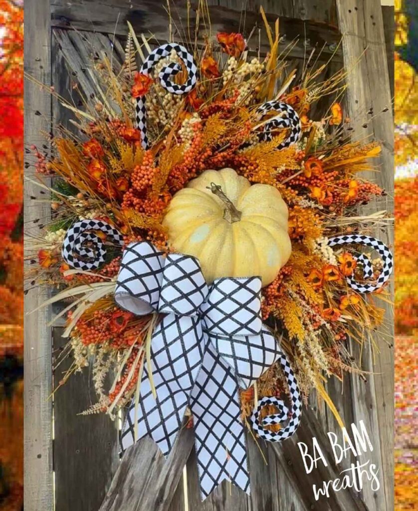 Fall wreath with white pumpkin and black-white geometric ribbons.