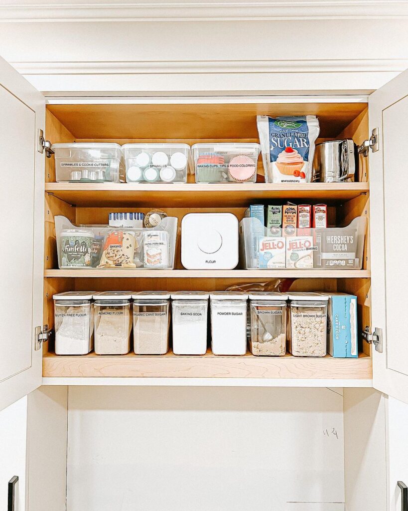 Organized baking supplies in labeled containers and bins.