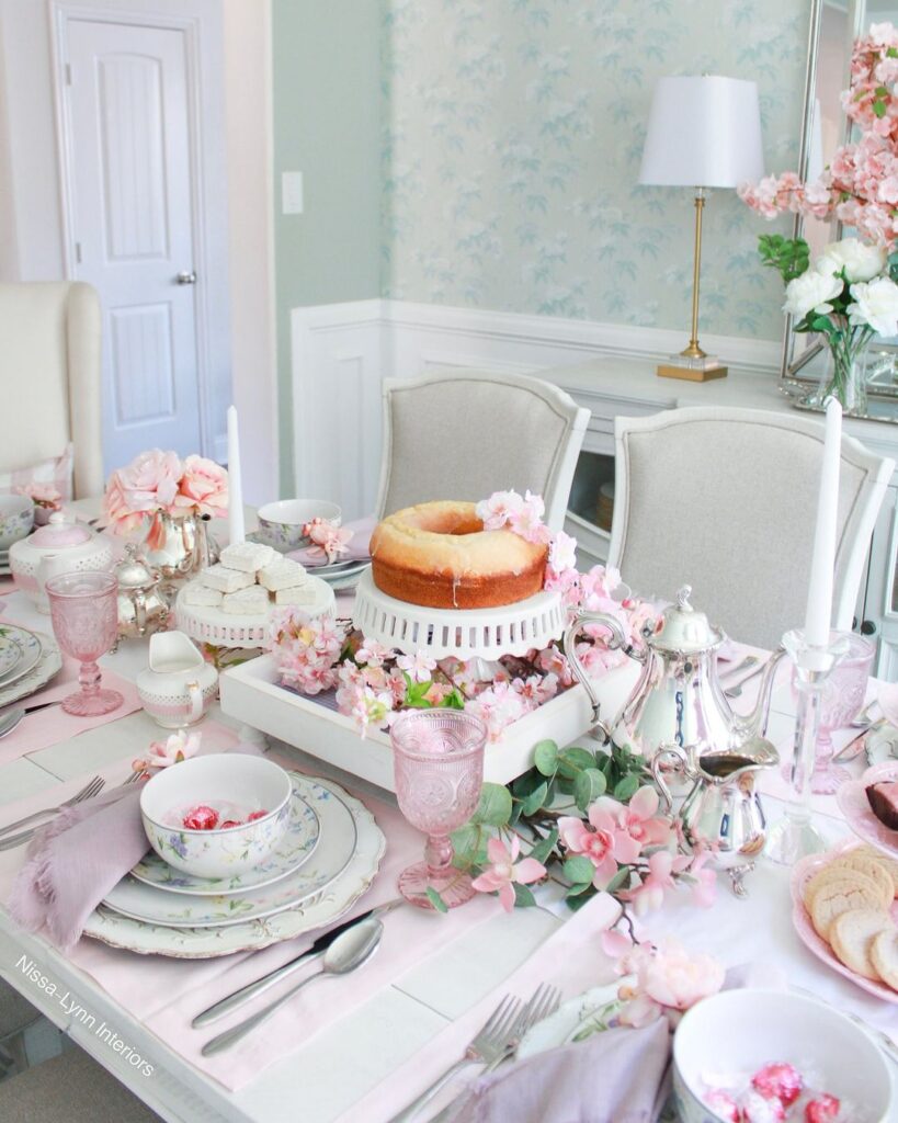 Pink floral Thanksgiving table with cake and teacups