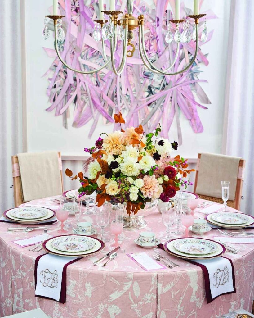 Elegant pink Thanksgiving table under crystal chandelier