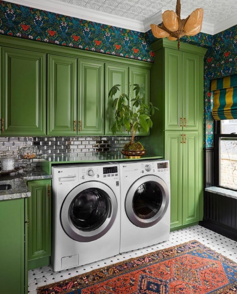 Green laundry room with floral wallpaper and patterned rug