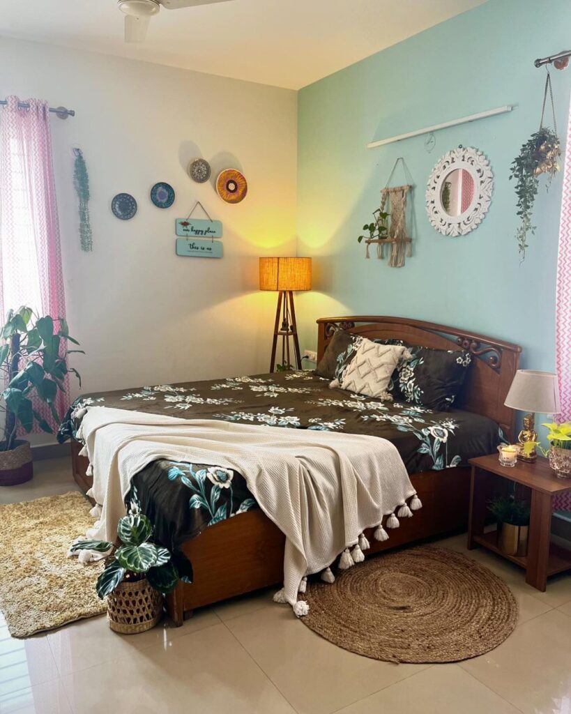 Bohemian bedroom with vintage bed and mint accent wall