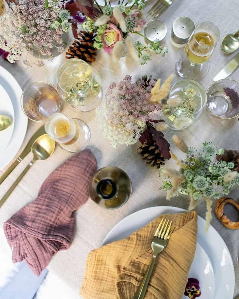 Bohemian Thanksgiving table with wildflowers and colorful napkins