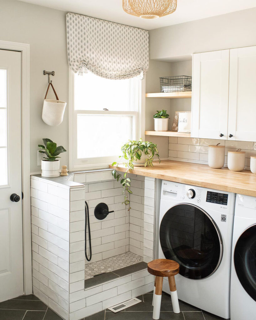 Laundry room with dog wash and modern appliances