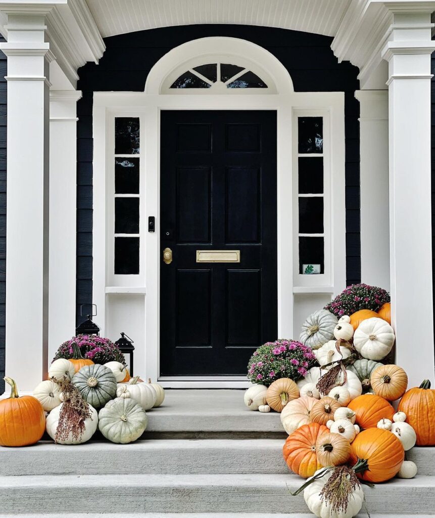 Black and white porch with colorful pumpkin display