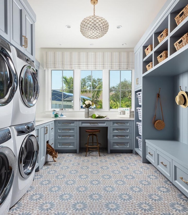 Bright blue laundry room with coastal decor