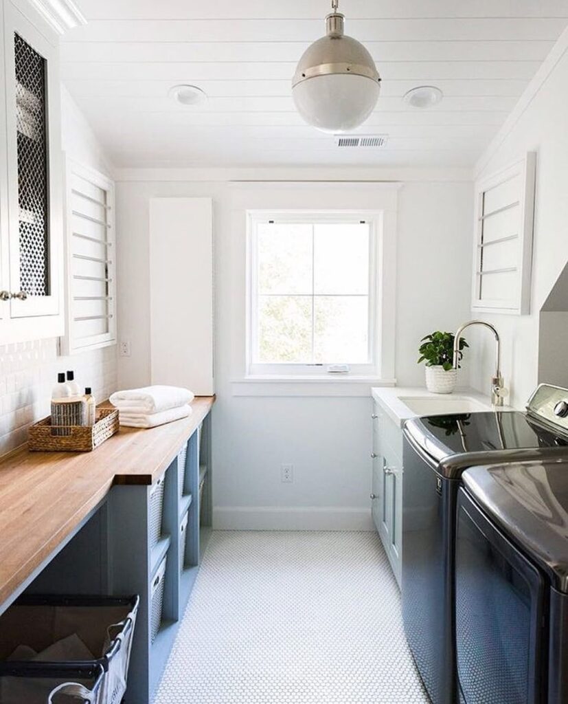 Airy laundry room with coastal-inspired decor.