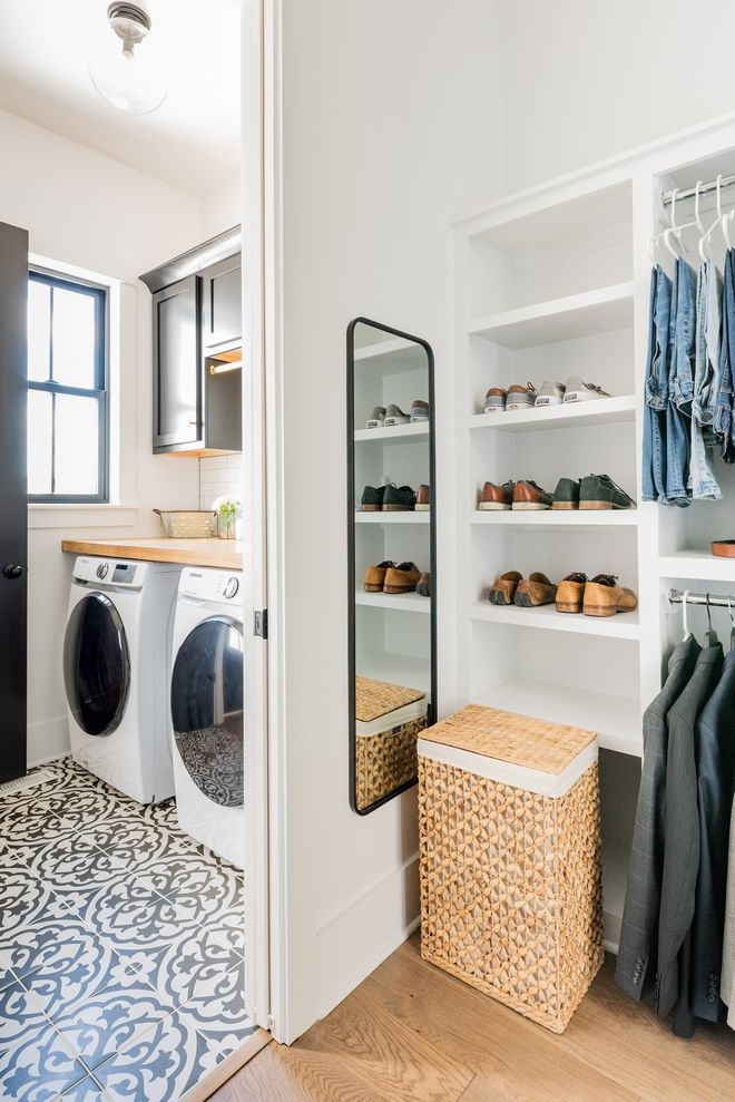 Efficient laundry room connected to organized mudroom area.