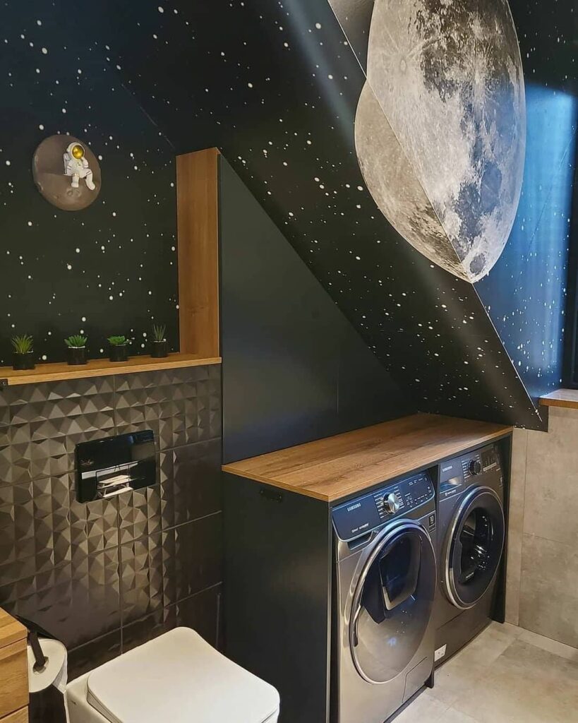 Laundry room with space-themed decor and moon wallpaper.