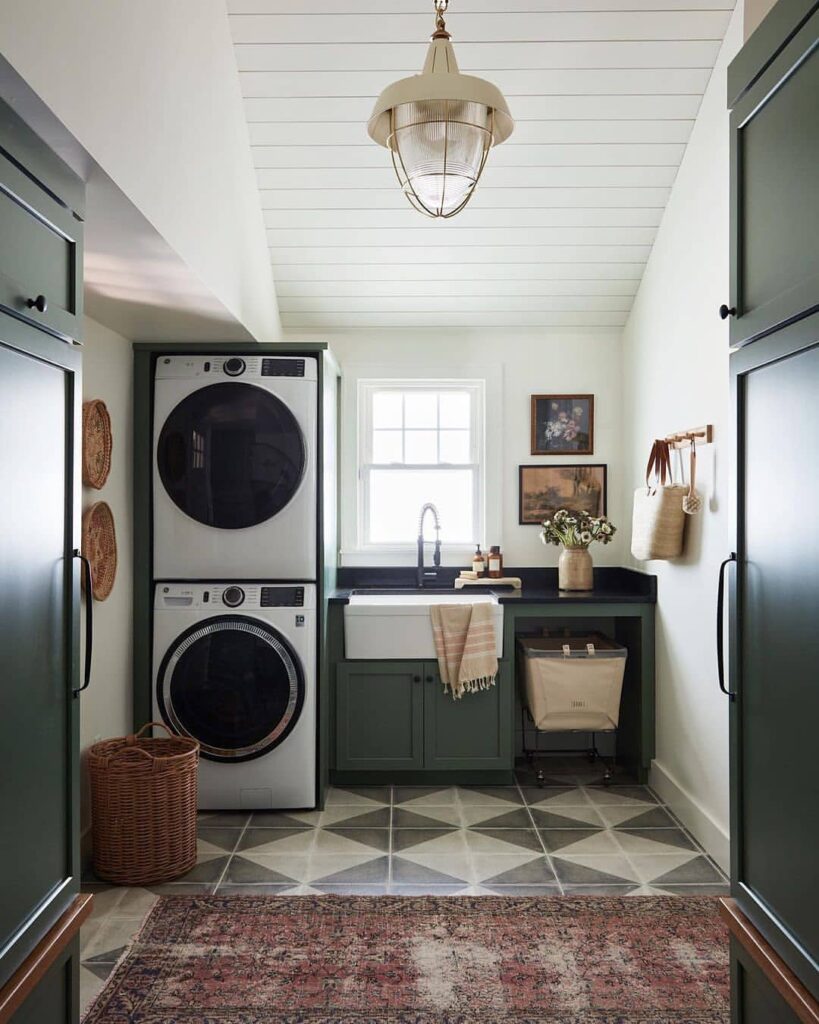 Compact laundry room with stacked washer dryer and farmhouse sink.