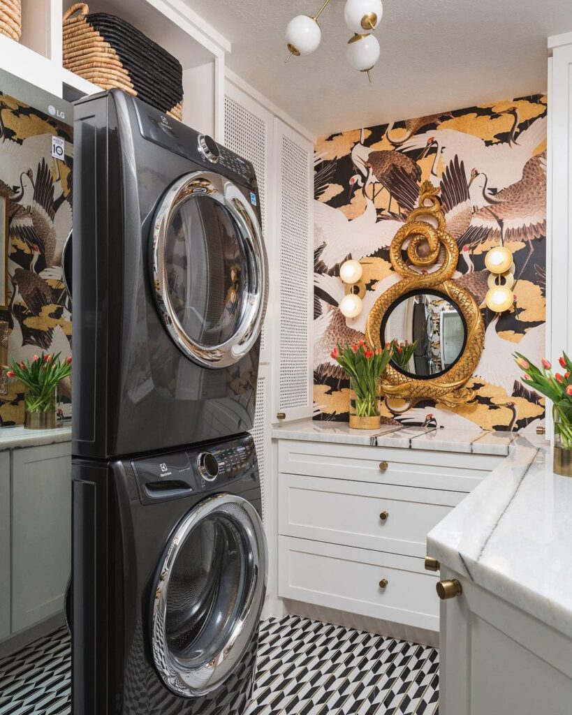 Luxurious laundry room with bird wallpaper and modern appliances