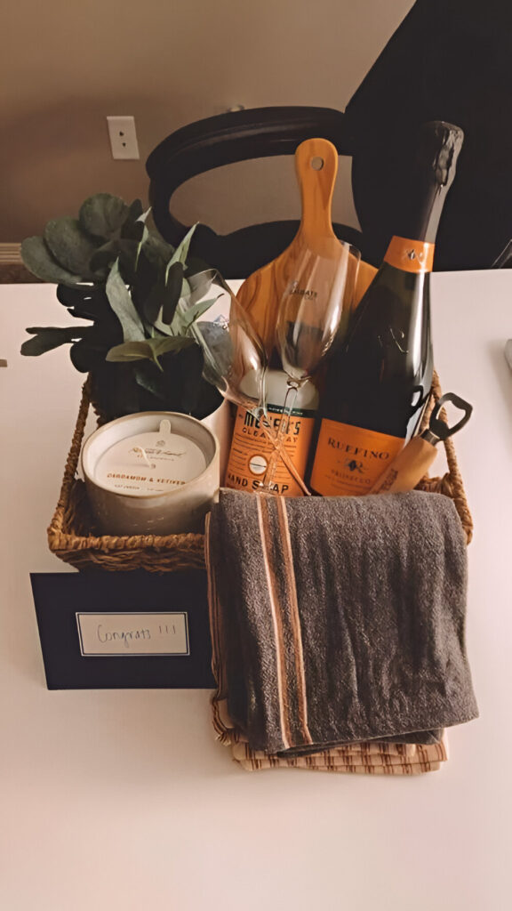 Luxurious housewarming basket with wine and essentials.