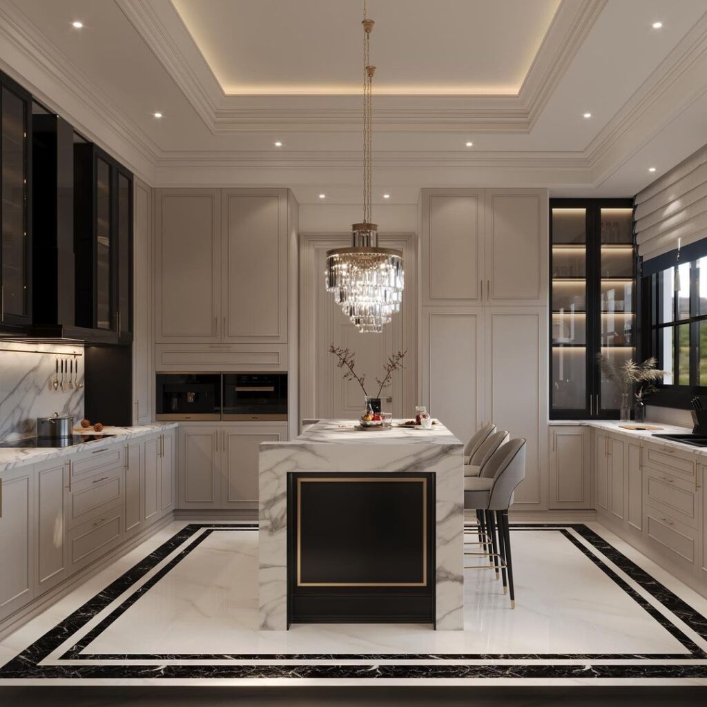 Upscale white kitchen featuring marble island and crystal lighting