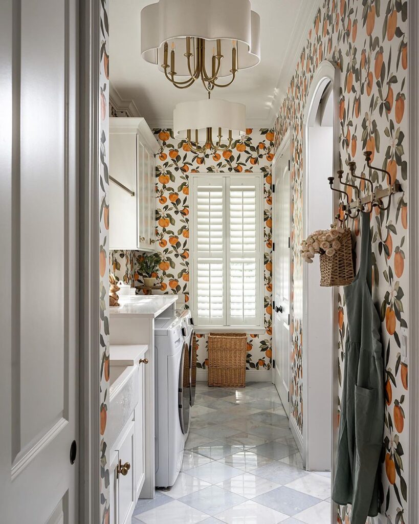 Bright citrus wallpaper in stylish laundry room.