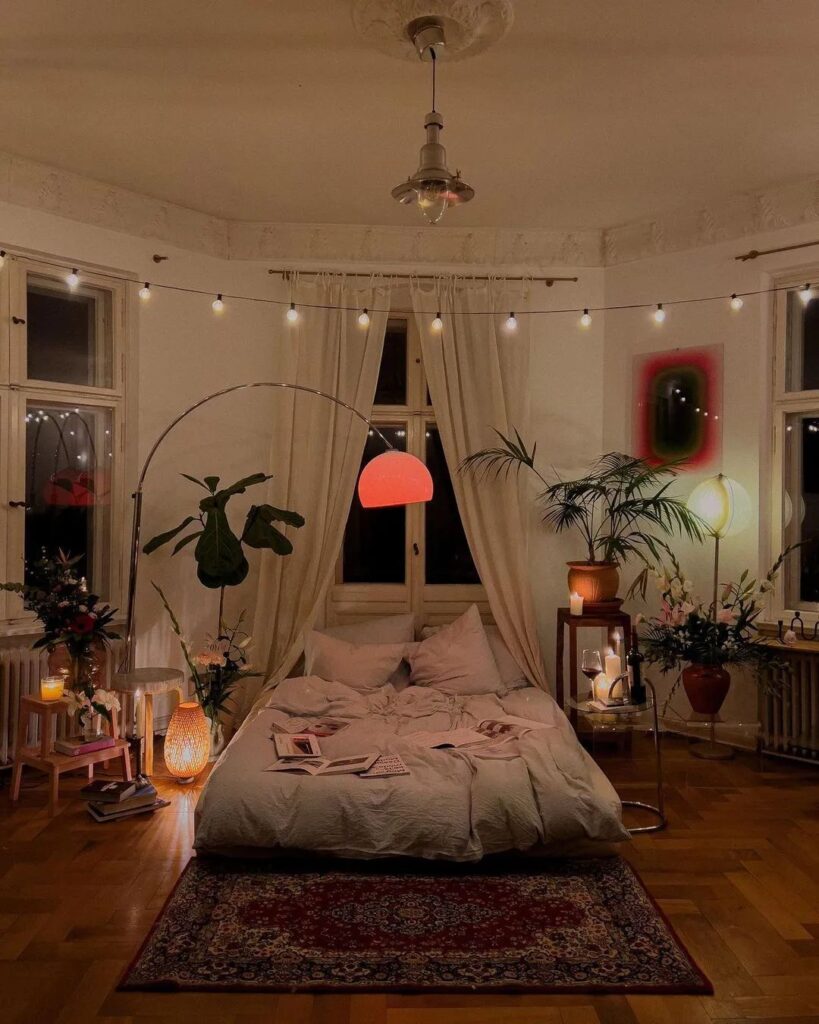 Cozy bedroom with string lights plants and warm ambiance