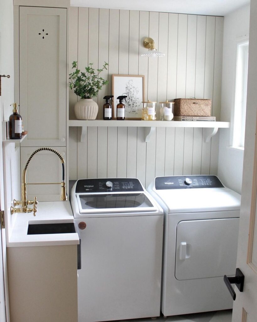 Elegant white laundry room with top-load machines