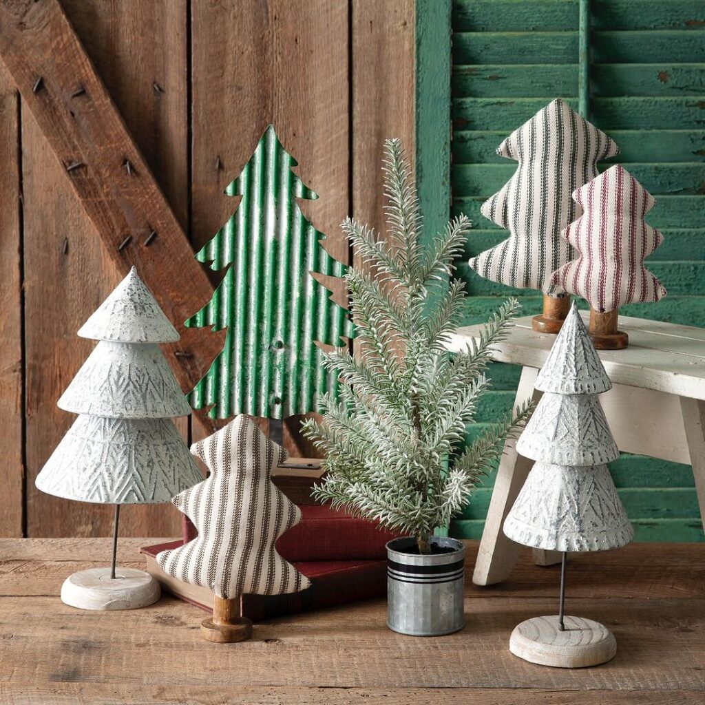 Assorted rustic Christmas tree decorations on wooden table