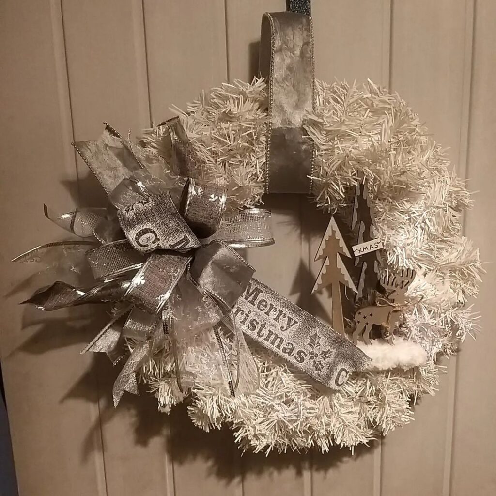 White tinsel wreath with silver decorations