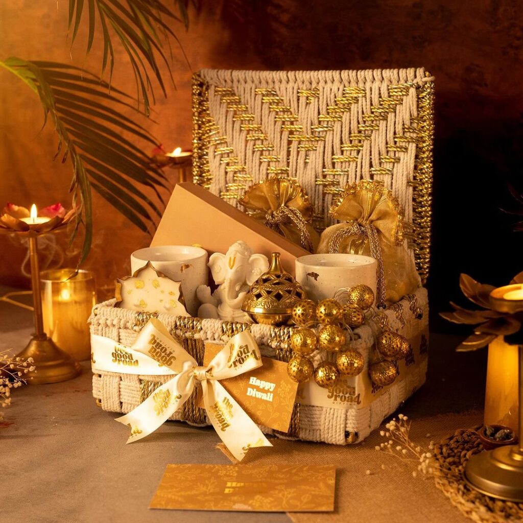 Diwali gift basket with gold decorations and candles