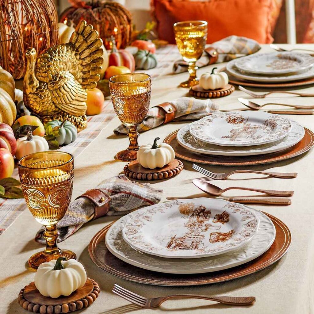  Elegant Thanksgiving table with gold accents and pumpkins