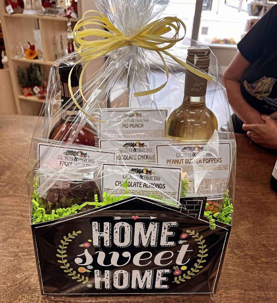 Gift basket with wine and snacks for housewarming