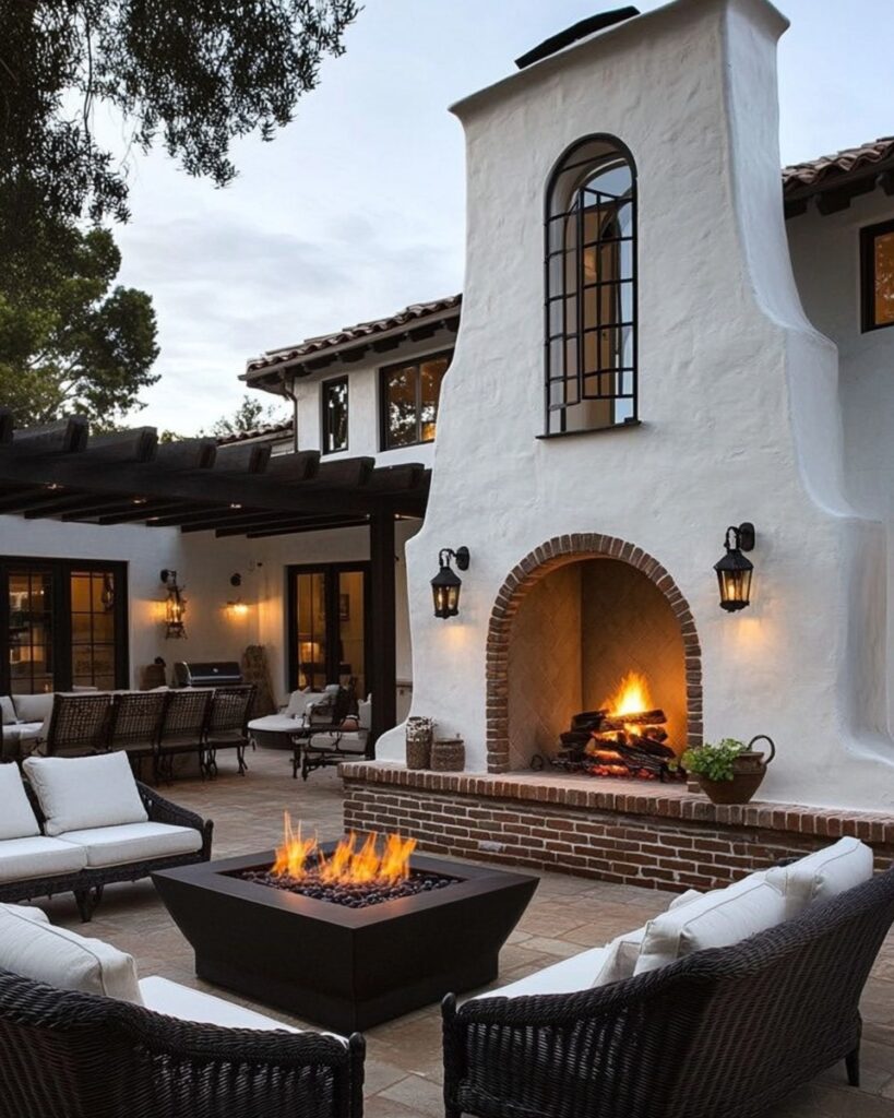 Spanish patio with fireplace fire pit and cozy seating.