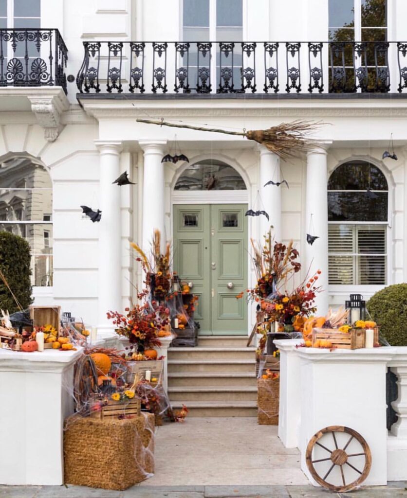 Elegant house entrance decorated with autumn harvest and Halloween touches