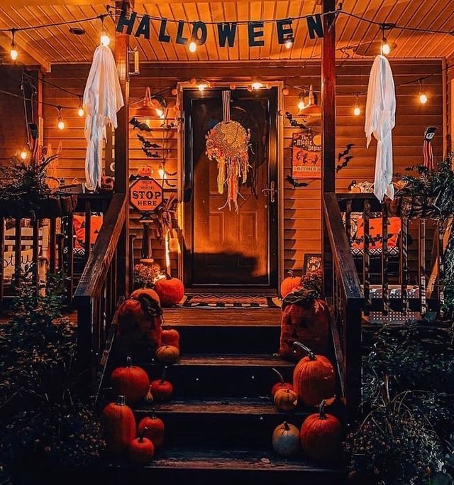 Cozy Halloween porch with pumpkins lights